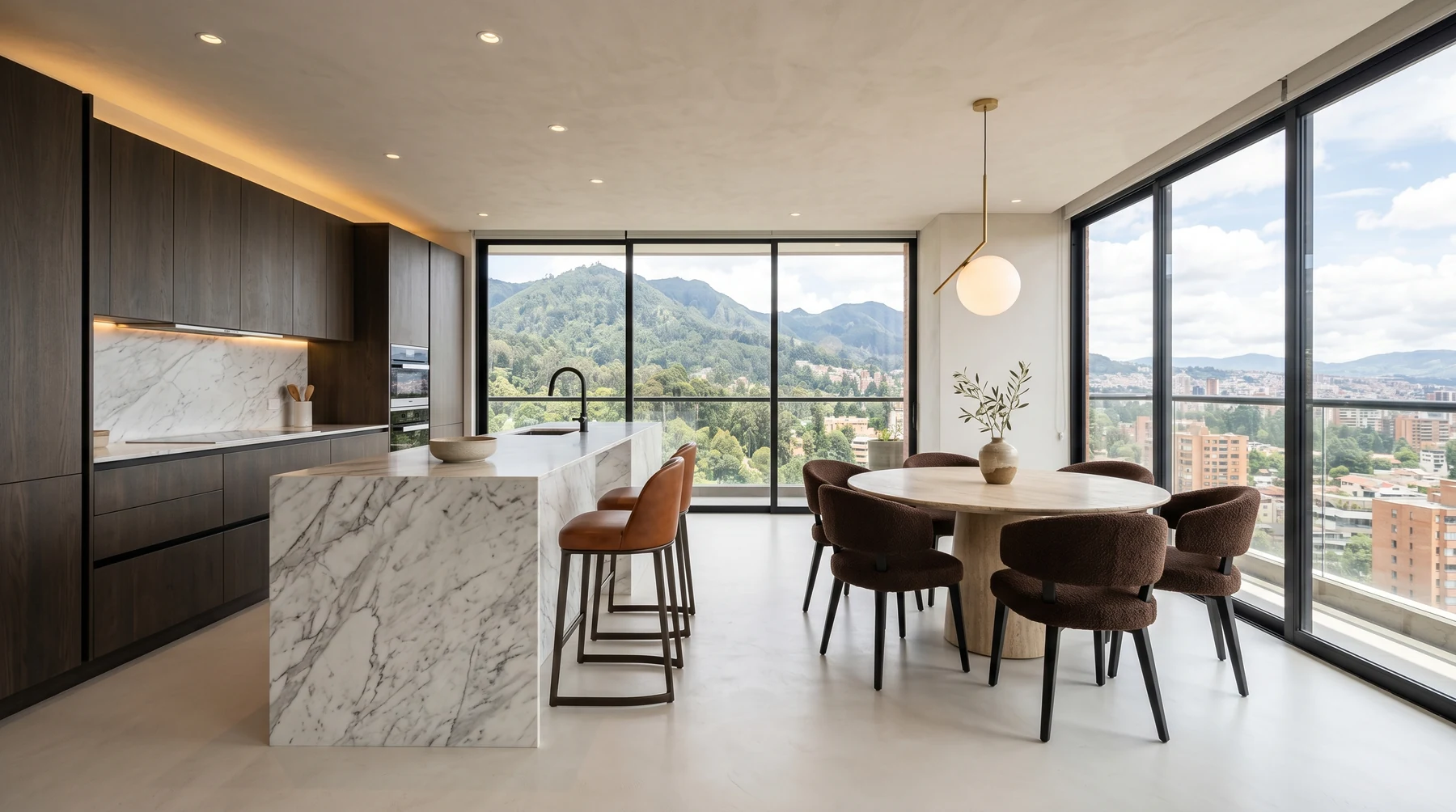 Cocina integrada con comedor en apartamento de lujo en Bogotá: isla central, mesa de comedor en línea, luz natural · diseño César Serrano